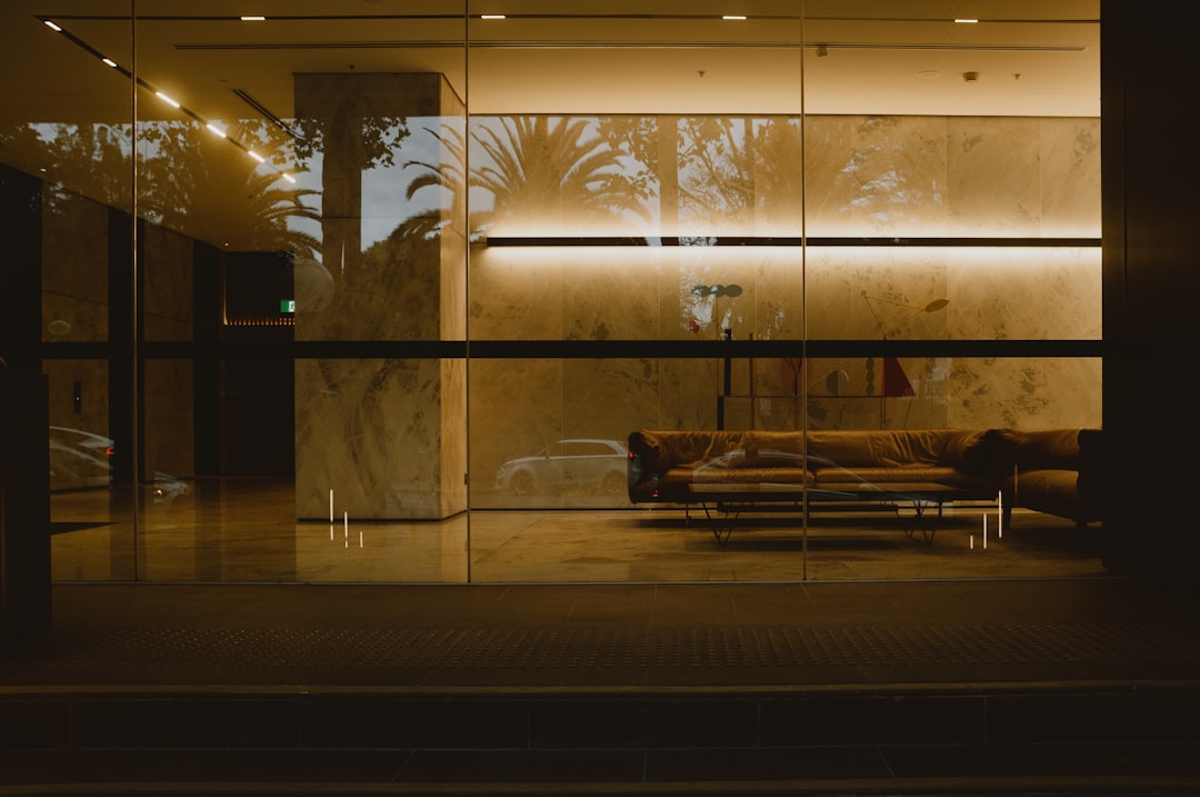 A modern building interior is illuminated at night.